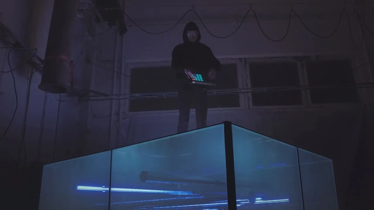 A performer controlling a light installation
